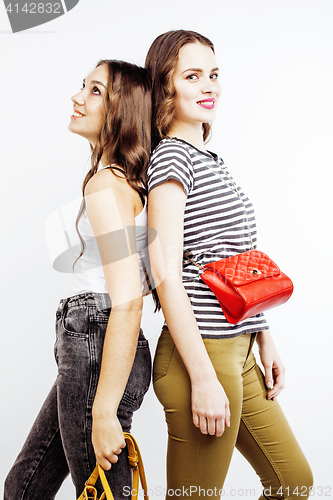 Image of two best friends teenage girls together having fun, posing emotional on white background, besties happy smiling, lifestyle people concept