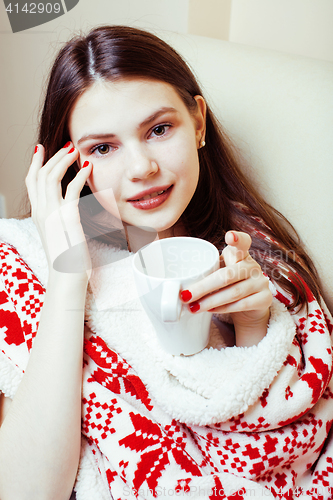 Image of young pretty brunette girl in Christmas ornament blanket getting warm on cold winter, freshness beauty concept, lifestyle people