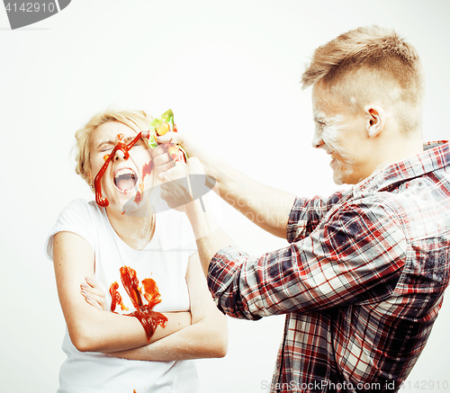 Image of young pretty couple, lifestyle people concept: girlfriend and boyfriend cooking together, having fun, making mess isolated on white background