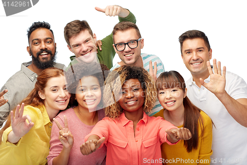 Image of international group of people showing thumbs up