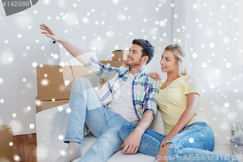 Image of couple with boxes moving to new home and dreaming