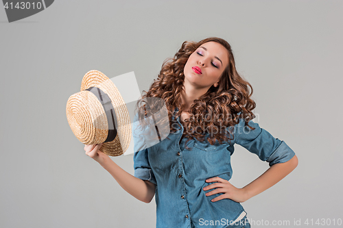 Image of The girl in straw hat