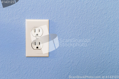 Image of Electrical Sockets In Colorful Blue Wall