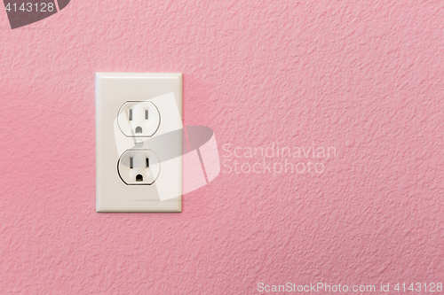 Image of Electrical Sockets In Colorful Pink Wall