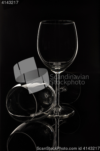 Image of Wineglasses On A Black Glass Studio Background