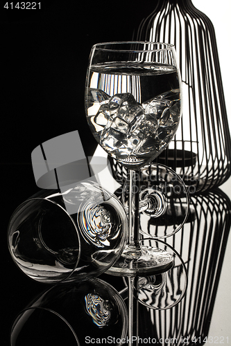 Image of Wineglasses On A Black Glass Studio Background