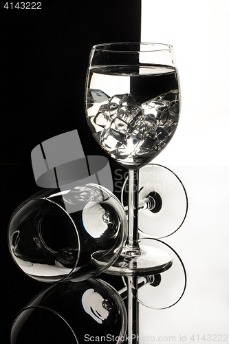 Image of Wineglasses On A Black Glass Studio Background