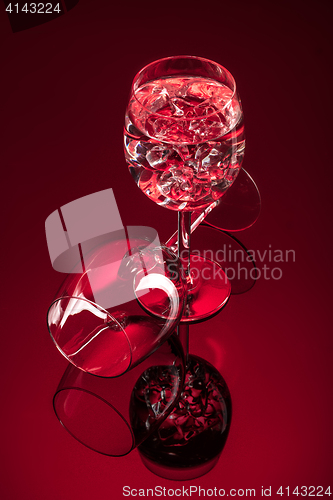 Image of Wineglasses On A Black Glass Studio Background