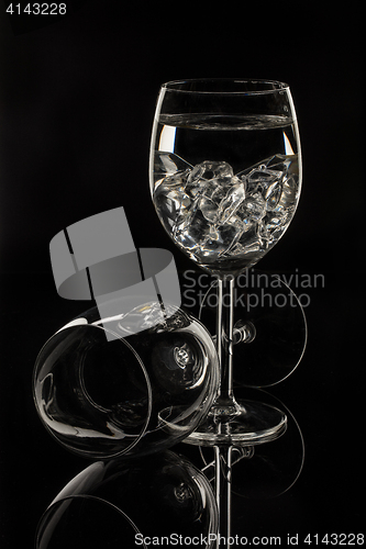 Image of Wineglasses On A Black Glass Studio Background