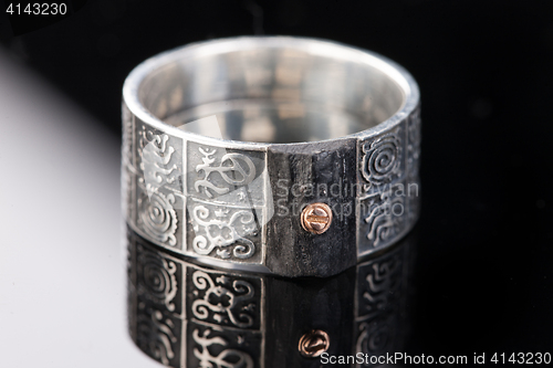 Image of Handmade jewelry on a black glass