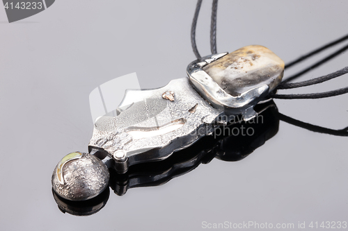 Image of Handmade jewelry on a black glass