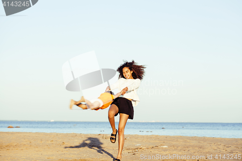 Image of pretty diverse nation and age friends on sea coast having fun, lifestyle people concept on beach vacations