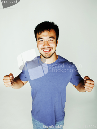 Image of young cute asian man on white background gesturing emotional, posing lifestyle people concept