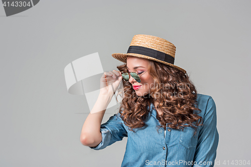 Image of girl in sunglasses and straw