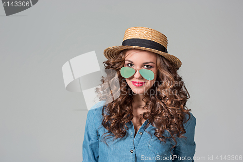 Image of girl in sunglasses and straw