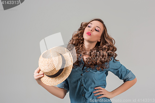 Image of The girl in straw hat