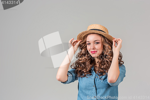 Image of The girl in straw hat