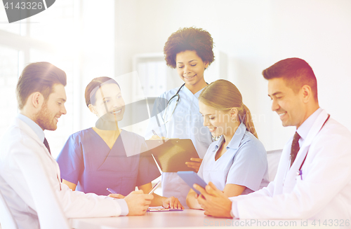 Image of group of happy doctors meeting at hospital office