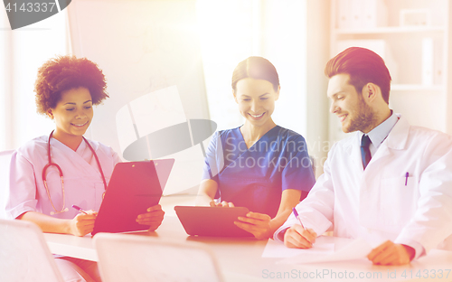 Image of group of happy doctors meeting at hospital office