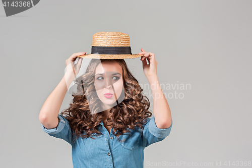 Image of The girl in straw hat