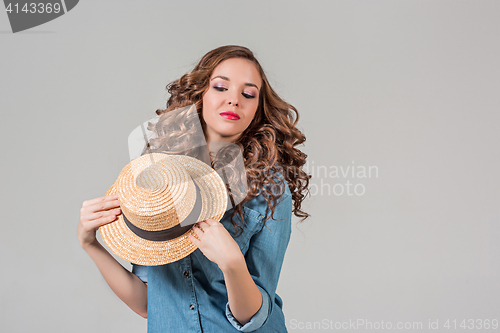 Image of The girl in straw hat