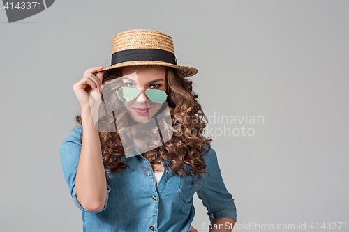 Image of girl in sunglasses and straw