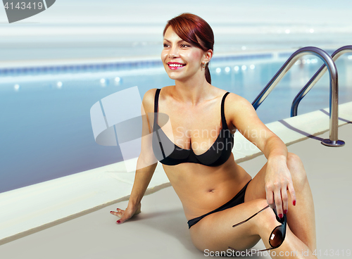 Image of happy woman in bathing suit relaxing