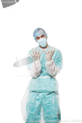 Image of Surgeon portrait. covered face with his hands. sad. isolated on white background