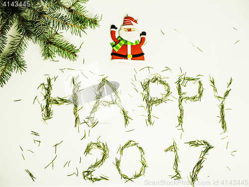 Image of happy new year design on white background with pine tree and santa claus