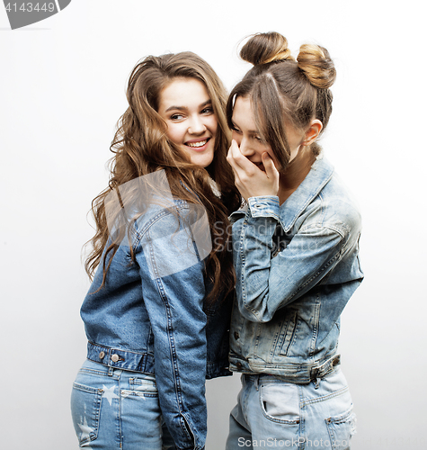 Image of lifestyle and people concept: Fashion portrait of two stylish sexy girls best friends, over white background. Happy time for fun.