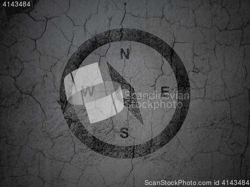 Image of Travel concept: Compass on grunge wall background