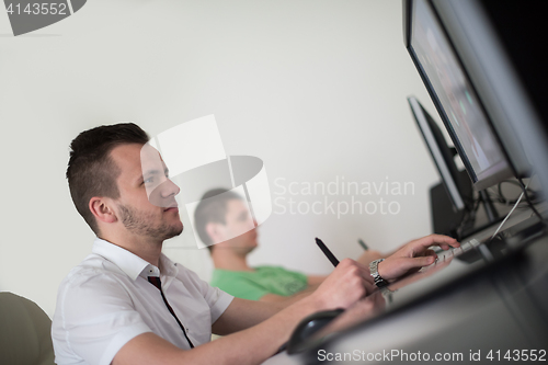 Image of a group of graphic designers at work