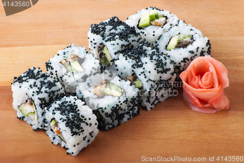 Image of california sushi rolls on wooden plate