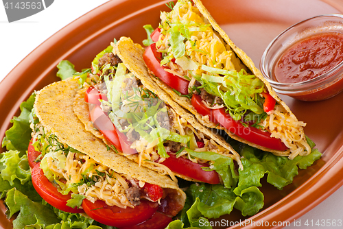 Image of beef tacos with salad and tomatoes salsa