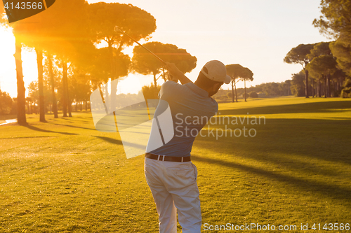 Image of golf player hitting shot with club