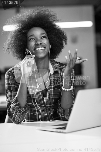 Image of portrait of a young successful African-American woman in modern 