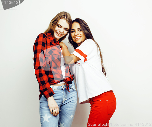 Image of best friends teenage girls together having fun, posing emotional on white background, besties happy smiling, lifestyle people concept, blond and brunette multi nations