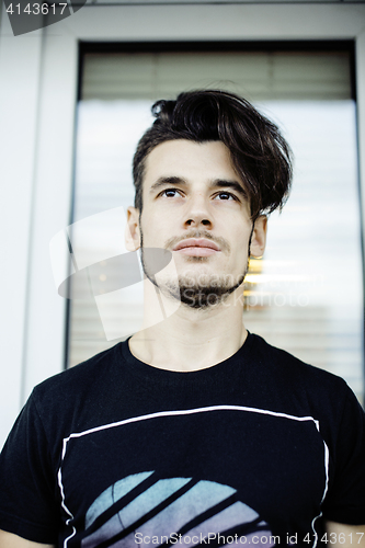 Image of young pretty hipster guy smiling on street, lifestyle people concept