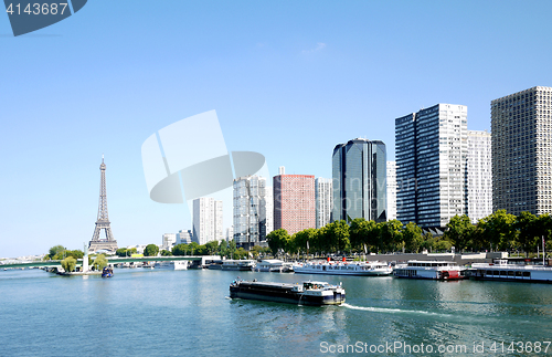 Image of Paris, barge on the Seine and Eiffel tower