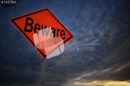 Image of Orange storm road sign of Beware