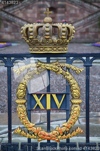 Image of The fence of the Royal Palace with crown in Stockholm, Sweden