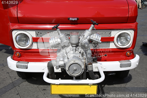 Image of Old vintage fire truck with pumps and pipes