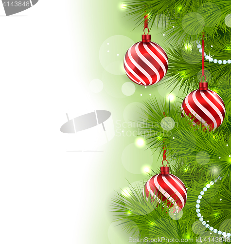 Image of Christmas glowing background with fir branches and glass balls