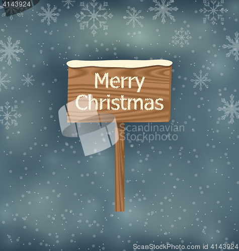 Image of Snow covered wooden sign, Merry Christmas background