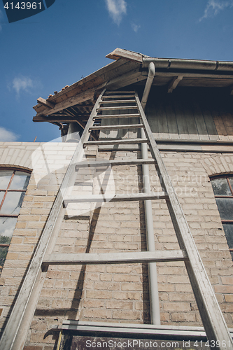 Image of Tall ladder at an old building