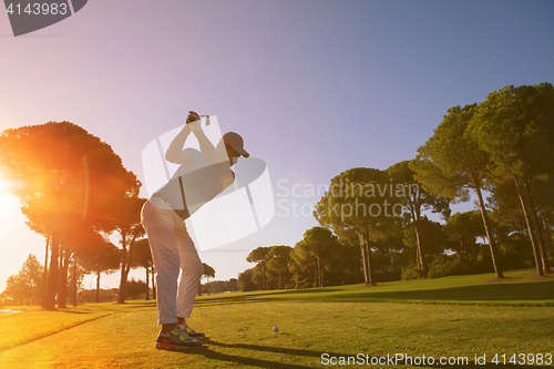 Image of golf player hitting shot with club