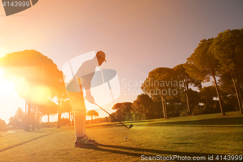 Image of golf player hitting shot with club