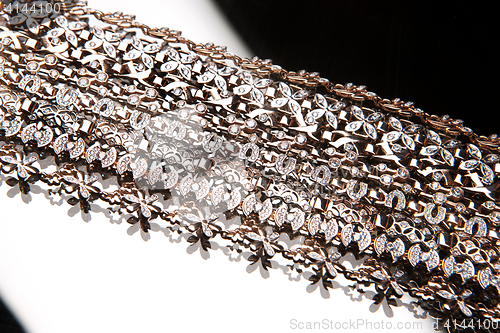 Image of Golden Bracelets On A Glass