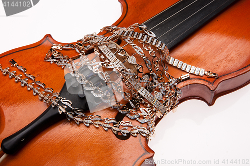 Image of Golden Bracelets And Violin