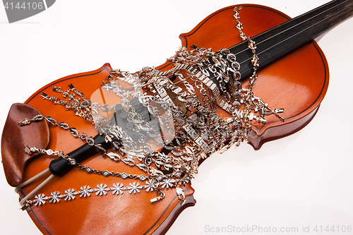 Image of Golden Bracelets And Violin